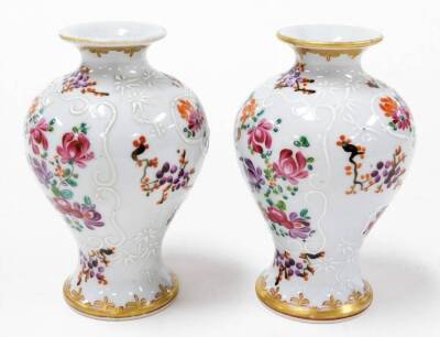 A Japanese Satsuma baluster vase, decorated with panels of peonies, wisteria and birds, 15cm high, and a pair of Samson Chinese armorial baluster vases, 12cm high. - 8