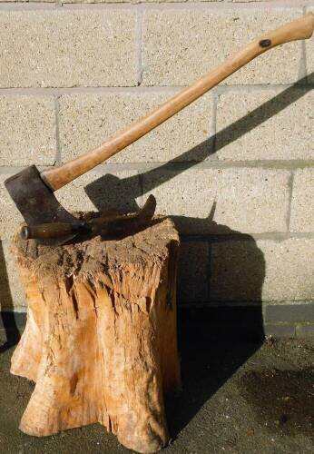 A log splitting axe and an Elwell stamped hatchet, on block stump.