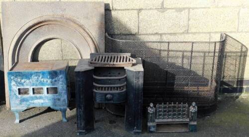 A Mirus enamel stove base, cast iron fire insert, cast iron fire grate, fire front and two fenders. (6)