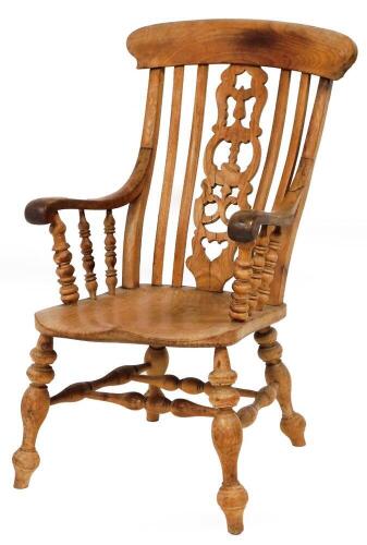 A Victorian ash and elm Grandfather chair, of large proportions, with pierced splat back saddle seat and double H frame stretcher.