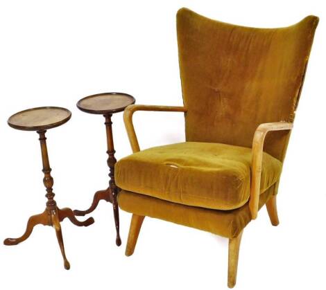 A mid-century crook arm fireside armchair and a pair of mahogany wine tables. (AF)