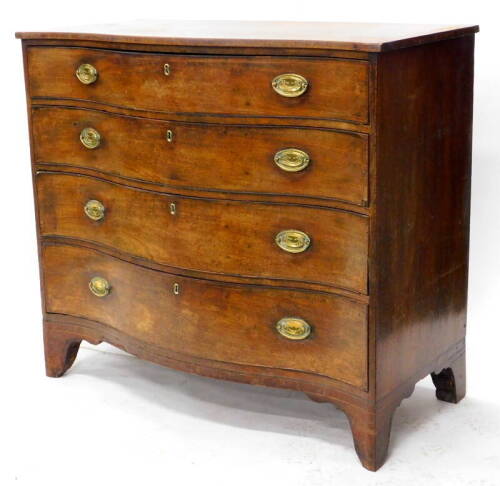 A George III mahogany and boxwood strung serpentine chest, the top with a crossbanded edge, above four graduated drawers, each with later oval brass handles, the top drawer with two divisions on bracket feet, 102cm high, 113cm wide, 56cm deep.