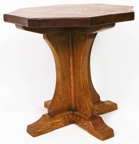 A Mouseman (Robert Thompson of Kilburn) style octagonal table, on inverted stem and platform feet, lacking mouse, 48cm high, 49cm wide, 51cm deep.