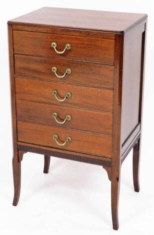 A early 20thC five drawer music chest, each drawer opening to a shelf, brass handles, on splay feet, with fret work base, 88cm high, 50cm wide, 36cm deep.