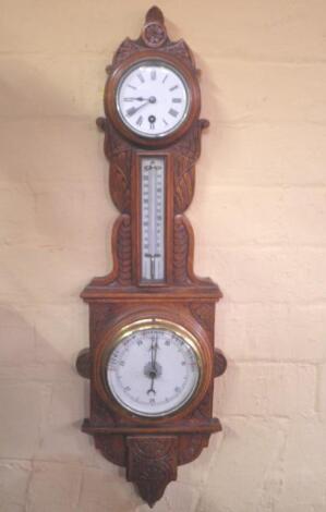 A late Victorian barometer and clock in a carved oak case<br