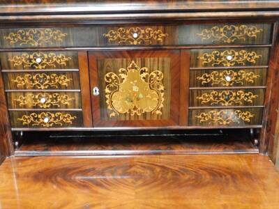 An early 19thC Biedermeier flame mahogany secrétaire à abattant, having a serpentine cushion drawer with oak lining to the surmount with scroll rococo supports, the cushion drawer over a fall flap revealing marquetry faced drawers with satin wood arabesqu - 2