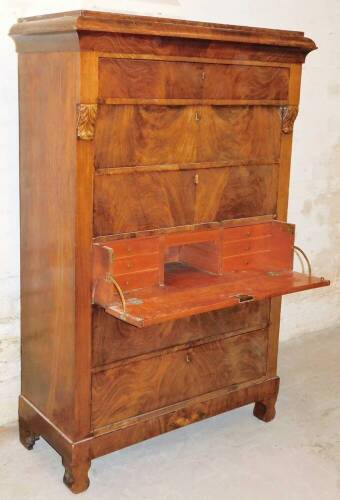 A 19thC Continental mahogany secretaire chest, the compressed caddy top raised above a frieze drawer, five further long drawers with carved acanthus leaf mouldings, on swell feet, 164cm high, 104cm wide, 46cm deep.