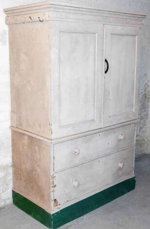 A 19thC painted pine kitchen cupboard, the upper section with a moulded cornice, raised above a pair of panelled doors, revealing two fixed shelves with two drawers beneath, on a block base, 182cm high, 120cm wide, 64cm deep.