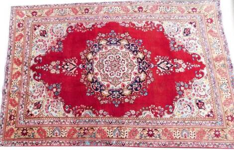 A vintage multicoloured Persian Tabreze rug, 280cm x 189cm.