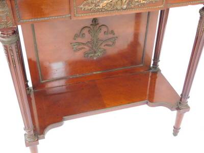 A late 19thC Louis XVI style mahogany vitrine, with metal mounts, the domed pediment cast centrally with musical instruments and flowers, over a frieze set with a panel of putti, flanked by scrolling flowers above two glazed doors, set with astragal glass - 6