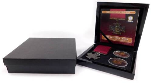 The Bradford Exchange Victoria Cross Silver Commemorative Set, comprising a replica VC medal., 9ct gold Elizabeth II double crown., and a silver crown, boxed with certificate.