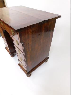 An early 18thC and later adapted walnut kneehole bachelor's secretaire chest, with folding top and raised on bun feet, 87cm high, 87cm wide, 58cm deep. - 4