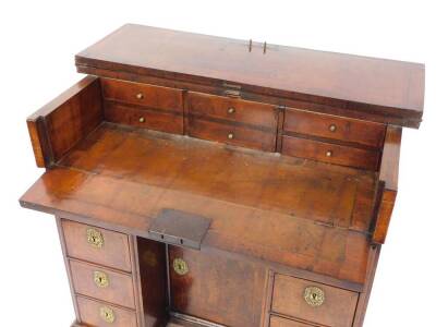 An early 18thC and later adapted walnut kneehole bachelor's secretaire chest, with folding top and raised on bun feet, 87cm high, 87cm wide, 58cm deep. - 7