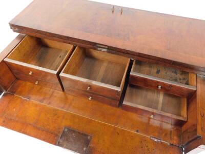 An early 18thC and later adapted walnut kneehole bachelor's secretaire chest, with folding top and raised on bun feet, 87cm high, 87cm wide, 58cm deep. - 8