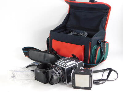 A Hasselblad 503CX camera, with Zeiss Planar f2.8 80mm lens, two A12 film backs and lens hood, in a camera bag. - 2