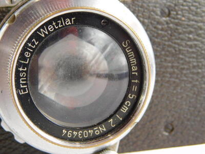 A Leica III camera, serial number 163566, with a Leitz 5cm f2 Summar lens, number 403494, in a leather case. - 2