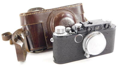 A Leica camera, with black body, believed by the Leica Society to be a Leica II conversion, serial number 20916, with a Leitz 5cm f3.5 Elmar lens, in a leather case.