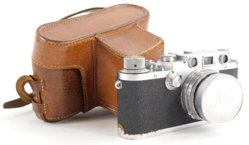 A Leica IIIc camera, serial number 500249, with a Leitz 5cm f2 Summitar lens, number 661835, in a leather case.