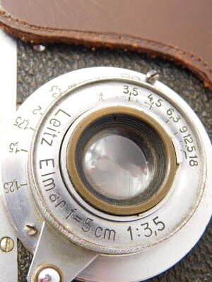 A Leica IIIa camera, serial number 357642, with a Leitz 5cm f3.5 Elmar lens, in a leather case. Auctioneer announce possibly a Russian copy. - 2