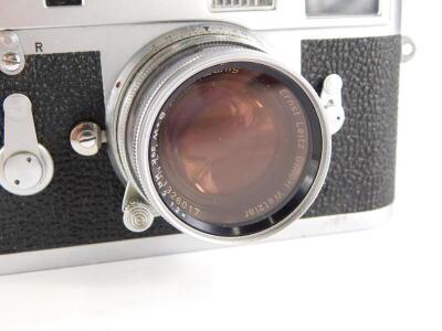 A Leica M2 camera, serial number 1069861, with a Leitz 5cm f2 Summicron lens, number 1326017. - 2