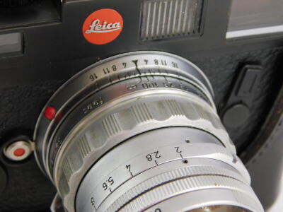 A black Leica M6 camera, with a Leitz 5cm f2 Summicron lens, number 1581384, and a half leather case. - 3