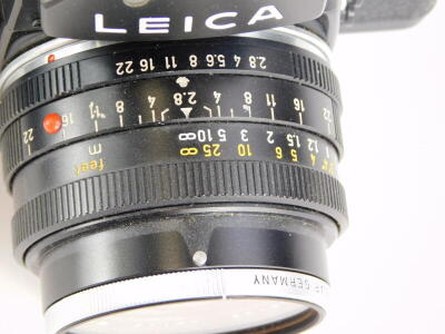 A black Leica R3 single lens reflex camera, with a Leitz 28mm f2.8 Elmarit R wide angle lens, number 2726096. - 3