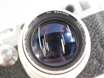 A 1947 Leotax Special DII camera, an exact Japanese copy of a Leica II, serial number 12648, the camera fitted with a Steinheil Munchen 8.5cm f2.8 Culminar lens, the body of the camera engraved 'Mioj,' signifying that the camera was made in occupied Japan - 2