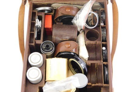 A brown leather Leitz Leica case, containing mixed Leica accessories. - 2