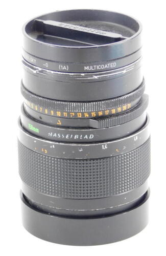 A Carl Zeiss Sonnar 150mm f4 lens, number 6559071, for a Hasselblad camera, with Hasselblad branding, etc.