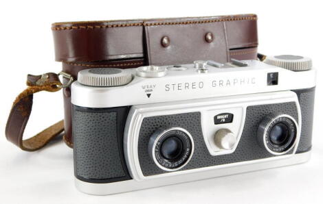 A Wray stereo graphic twin lens camera, in a leather case.