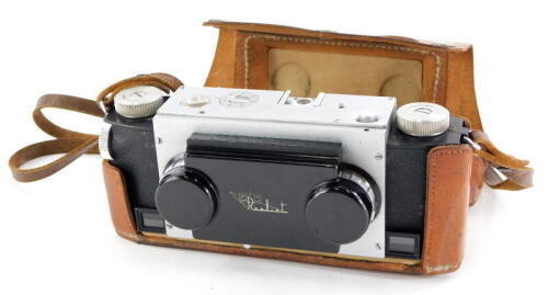 A Realist stereo twin lens camera, in a leather case.