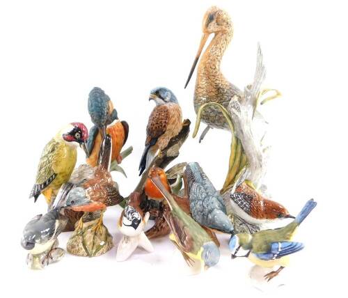 A group of Mack porcelain figures of birds, comprising green woodpecker., nuthatch., wren., black tailed godwit., kestrel and a Dartford warbler., together with Goebel birds, comprising yellow wagtail., blue titmouse., crested tit., robin and kingfisher,