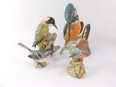 A group of Mack porcelain figures of birds, comprising green woodpecker., nuthatch., wren., black tailed godwit., kestrel and a Dartford warbler., together with Goebel birds, comprising yellow wagtail., blue titmouse., crested tit., robin and kingfisher, - 2