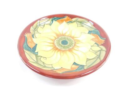 A Moorcroft pottery plate decorated in the Inca Sunflower pattern, painted and impressed marks, 26cm diameter. - 2