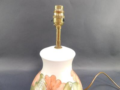 A Moorcroft pottery table lamp decorated in the Hibiscus pattern, of ginger jar and cover form, against a cream ground, impressed marks, 32cm high. - 3