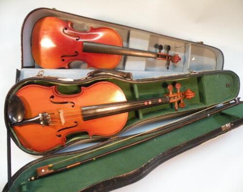 A Chinese 'Parrot' model child's violin and bow and another child's