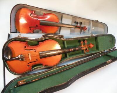 A Chinese 'Parrot' model child's violin and bow and another child's