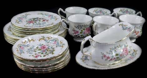 A Royal Standard porcelain part dinner and tea service decorated in the Mandarin pattern, comprising oval meat platter, pair of vegetable tureens and covers, sauce boat on stand, five dinner plates and side plates, six tea cups, saucers and plates.