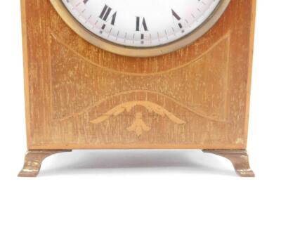 An Edwardian mahogany and inlaid mantel clock, enamel dial bearing Roman numerals, clock work movement, the case of domed form, raised on brass bracket feet, 18cm high, 12cm wide. - 4