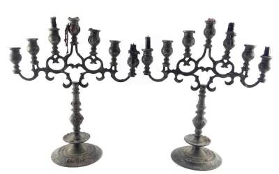 A pair of Judaica weighted pewter Menorah, 46cm high, 39cm wide.