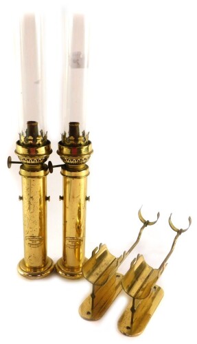 A pair of Danish brass maritime Kerosene lamps, by G V Harnisch EFTF of Kjobenhavn., Nos 61958 and 61132., with brackets, 37cm high.