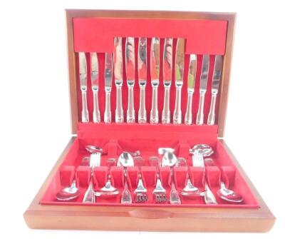 A French stainless steel canteen of cutlery by Guy Degrenne, decorated in the fiddle and shell pattern, cased, 44 pieces.