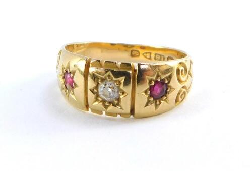 An Edwardian lady's 18ct gold diamond and ruby three stone ring, size M, 4.2g.