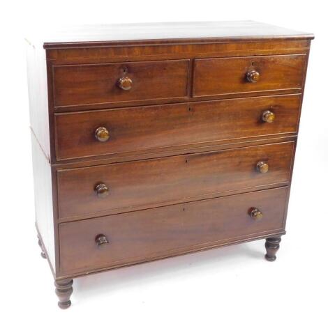 A Victorian mahogany chest, of two short over three long drawers, raised on turned legs, 118cm high, 119cm wide, 51.5cm deep.