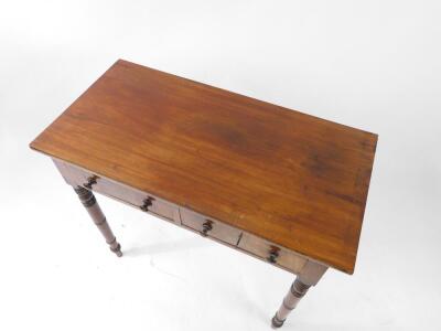 A late Georgian mahogany side table, with two frieze drawers, one lockable, raised on ring turned legs, 74.5cm high, 84.5cm wide, 42.5cm deep. - 2