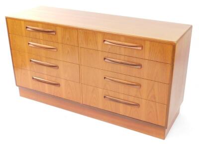 A G plan teak chest of eight drawers, raised on a plinth base, 75.5cm high, 141.5cm wide, 44.5cm deep.