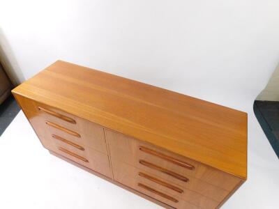 A G plan teak chest of eight drawers, raised on a plinth base, 75.5cm high, 141.5cm wide, 44.5cm deep. - 2