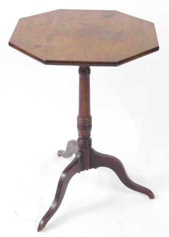 A late Georgian mahogany tilt top occasional table, the octagonal top raised on a ring turned column over three cabriole legs, 67cm high, 46.5cm diameter.