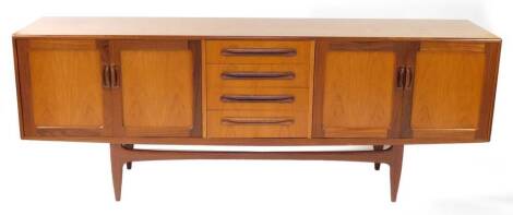 A G plan teak sideboard, with four central drawers flanked by two pairs of cupboard doors, raised on tapering square central legs, 80cm high, 213cm wide, 45.5cm deep.