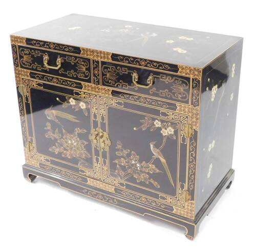 A TCC Chinese 20thC black lacquered chest, painted with birds and blossom, having two frieze drawers above a pair of cupboard doors opening to reveal a single shelf, raised on ogee bracket feet, 77cm high, 91cm wide, 45.5cm deep.